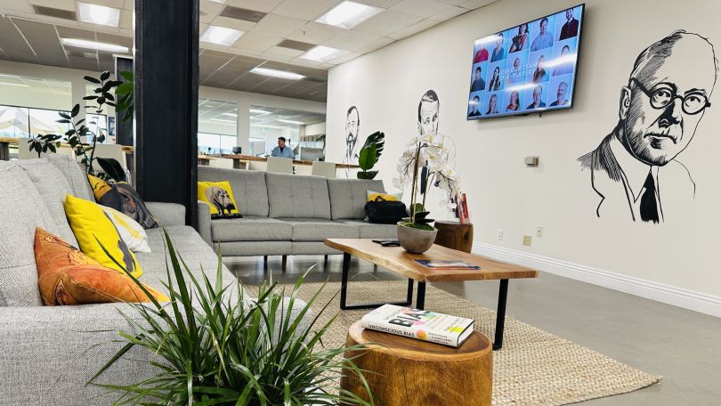 A photo of the Golden Hippo office in a lounge area with modern art and murals. 